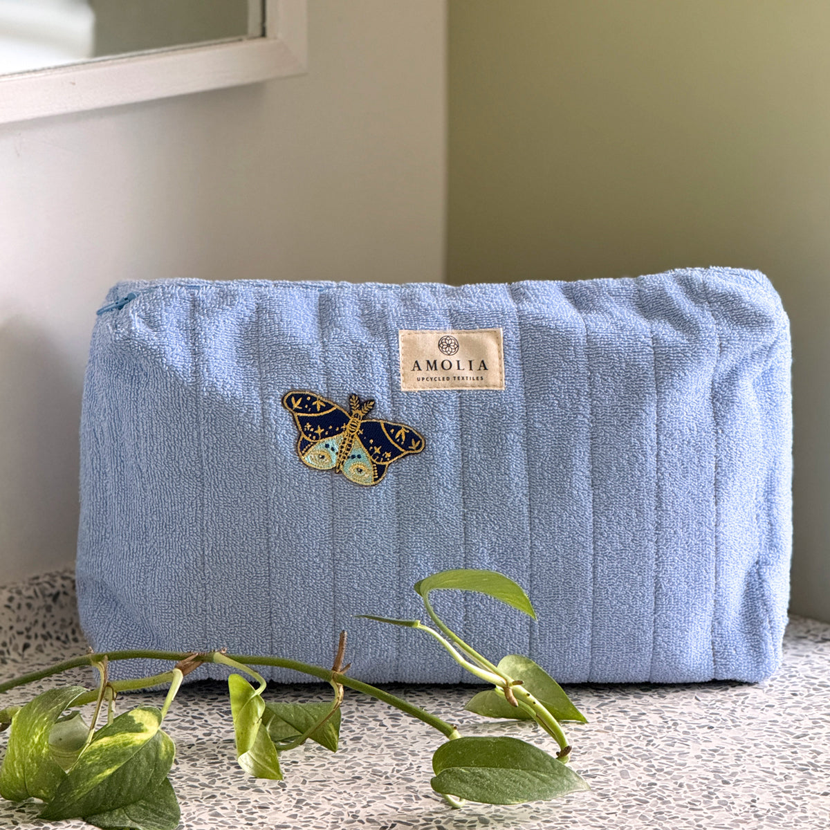 Upcycled toiletry bag, large, light blue with butterfly - limited edition