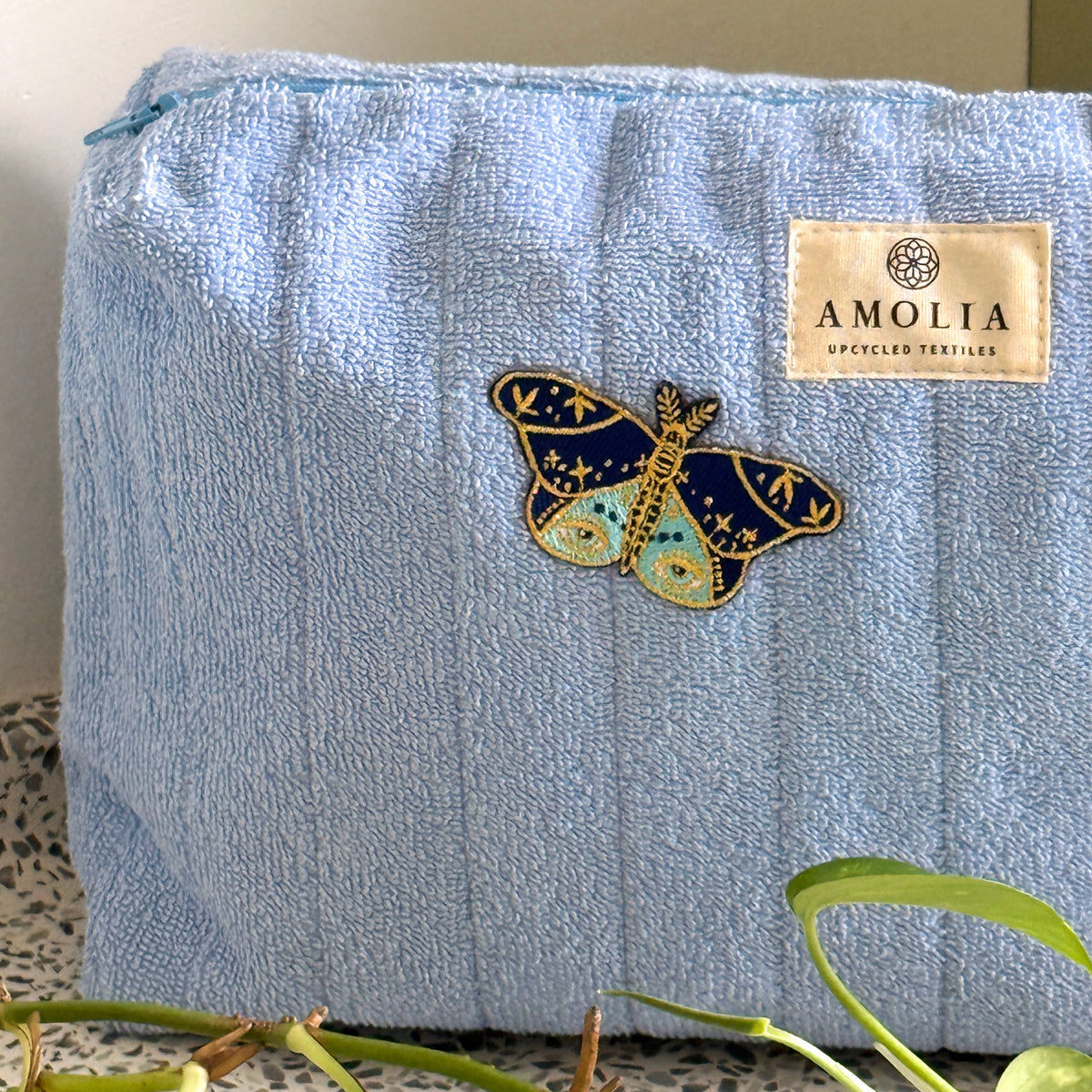 Upcycled toiletry bag, large, light blue with butterfly - limited edition