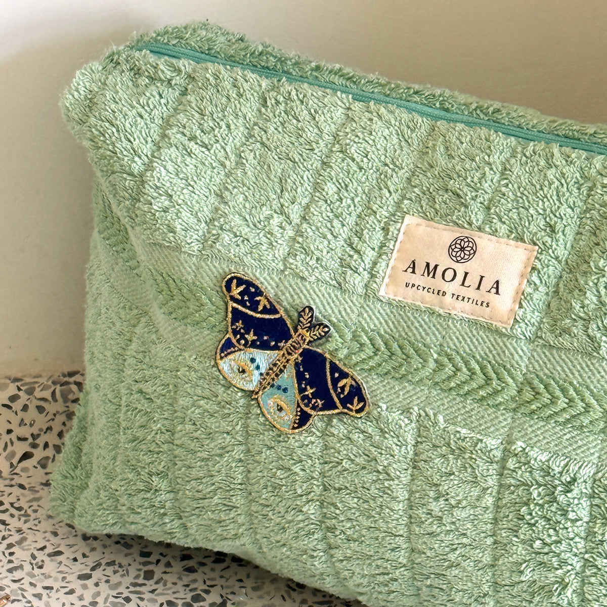 Upcycled toiletry bag, large, light green with butterfly - limited edition
