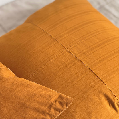 Set of two upcycled cushions, burnt orange stripes, feather inners included